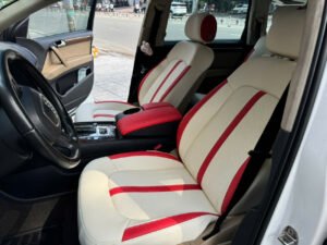 Hình ảnh thực tế bộ ghế da ô tô phối màu đỏ – kem được Trường Tuấn Auto thi công hoàn thiện cho khách tại xưởng.